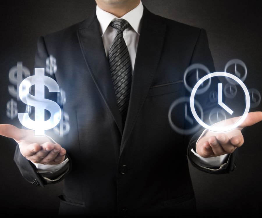 Man in dark suit standing with palms held out. Hovering over each hand is a hologram of a dollar sign and a clock respectively